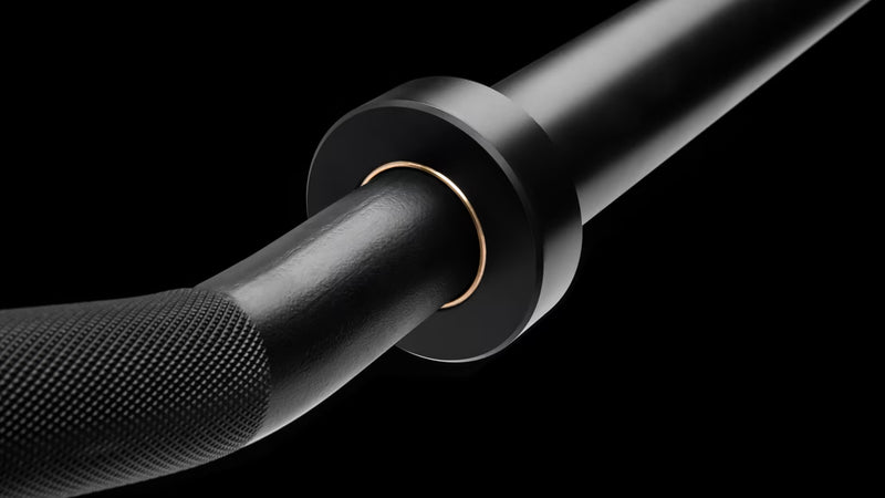 ROGUE CB-4 38mm キャンバーバー ブラック、スリーブ根元とブッシング部を斜めから捉えたクローズアップ、回転構造とシャフト接合部が確認できるスペシャリティバーベル