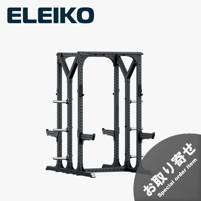 ELEIKO プレステララック ブラックのダブルハーフラック・ショートタイプ。斜め前方から見た全体構造で、2面のトレーニングスペース、上部クロスバー、セーフティアーム、プレート収納ホルダーを備えたフリーウェイト用ラック。
